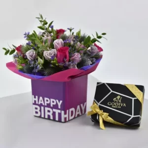 گل های پر جنب و جوش و شکلات های گودیوا برای تولد